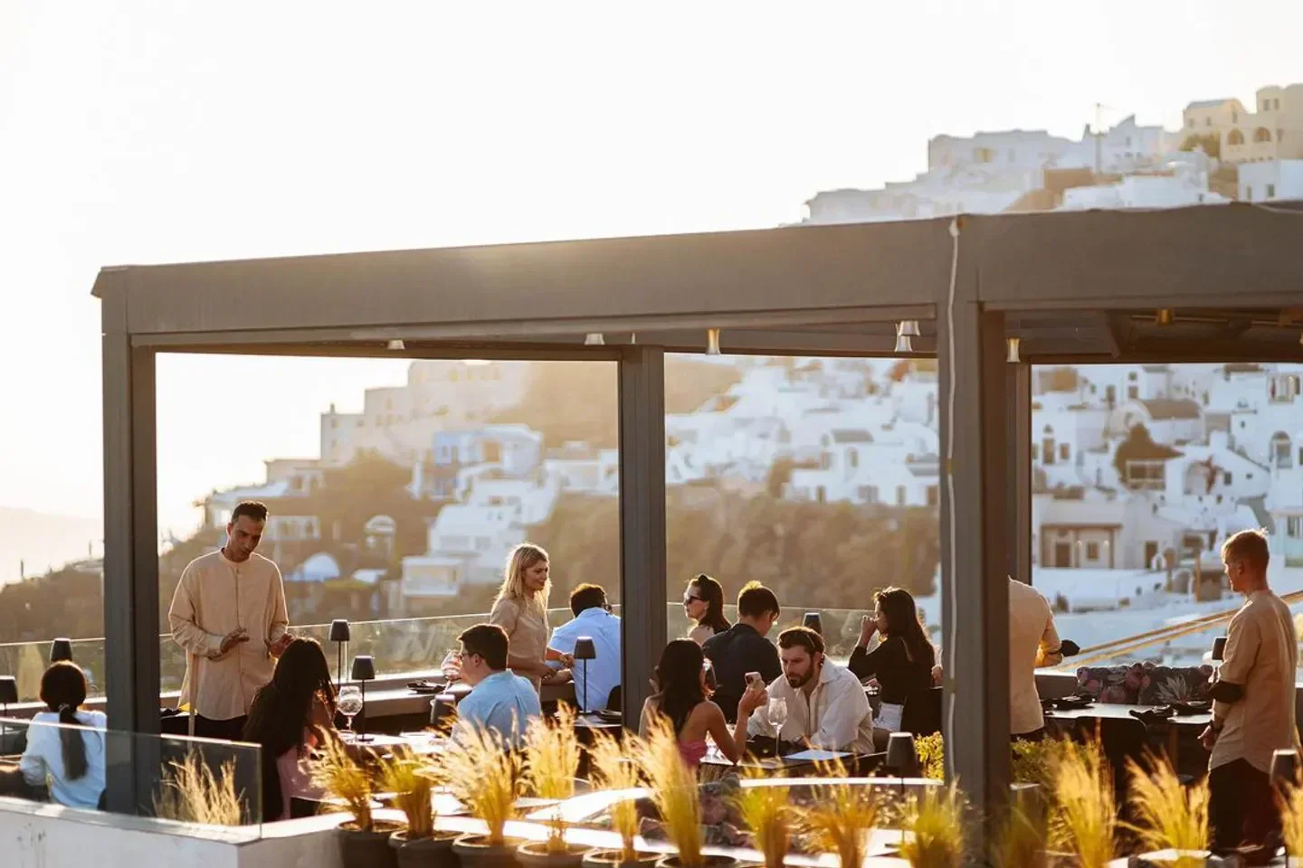 Dining at La Maison Santorini, a restaurant with stunning views of the island.