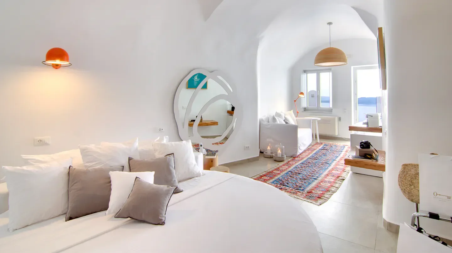 Cozy bedroom at Santorini Secret Suites & Spa in Santorini with sea view